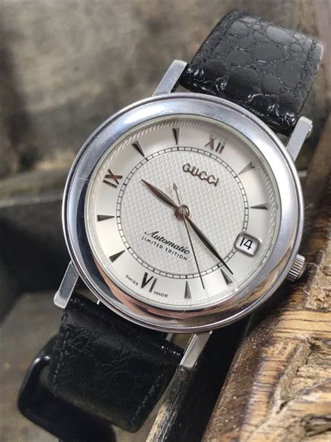 SIGNED GUCCI, MODEL 7400 AUTOMATIC AND MODEL 